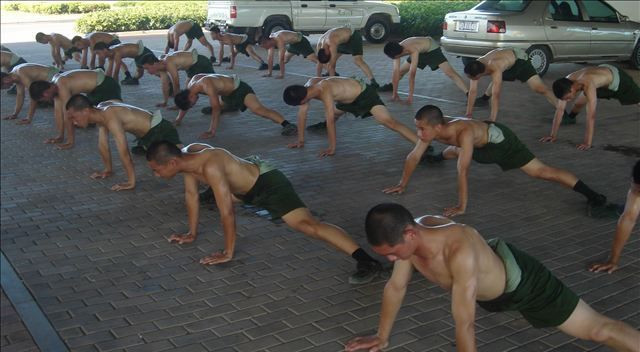 china army service men doing push-up training