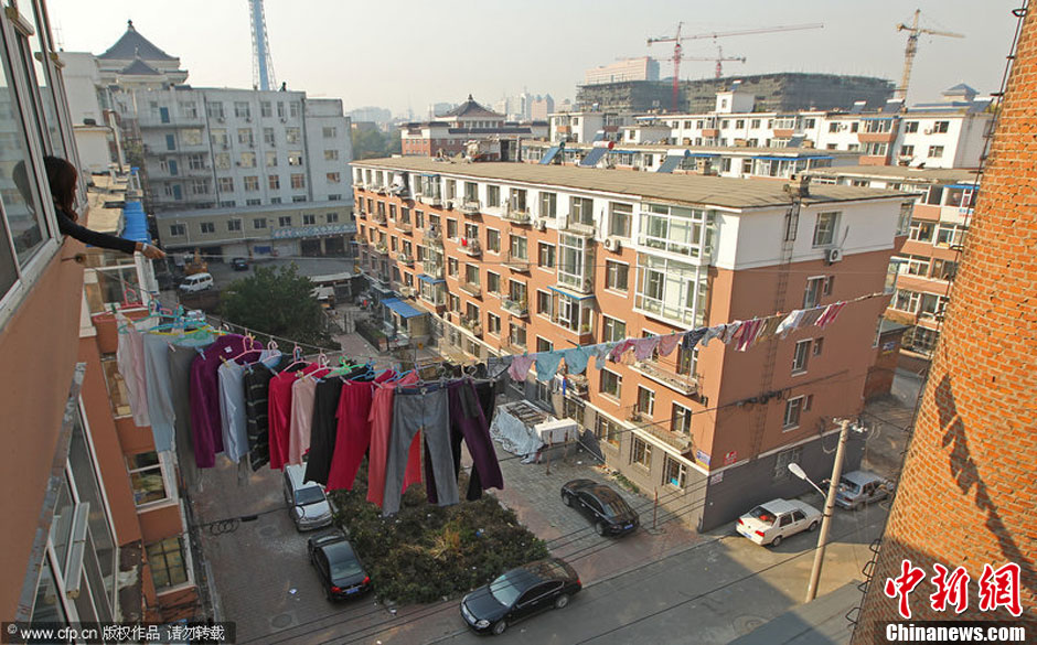 chuangchun resident is drying laundry on chimney