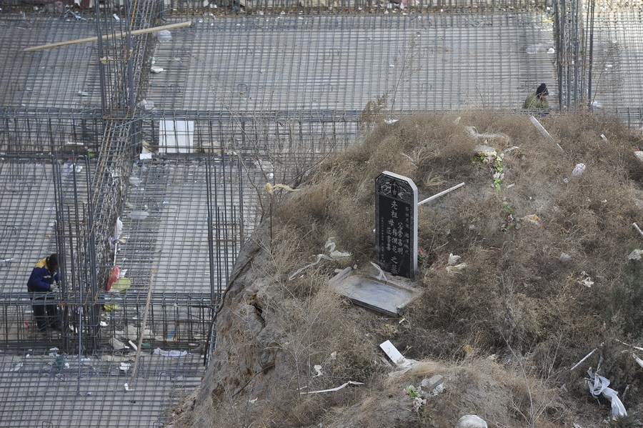 the funny picture shows a tomb was enclosed in a new building