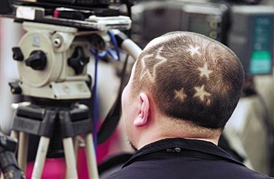 camera man's haircut keep changing to match congress topic