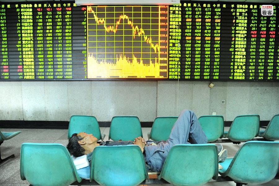 a Chinese stock trader is sleeping in an empty stock exchange hall